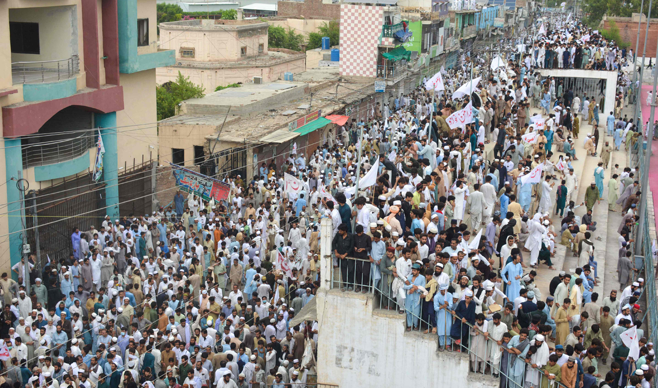 Residents take part in a peace rally to protest after the recent suicide attack by militants on an army enclave in Bannu, on July 19, 2024. Eight Pakistani troops were killed when a suicide bomber rammed an explosive-packed vehicle into an army enclave, the military said on July 16, as the country battles a rise in militant activity. (AFP)