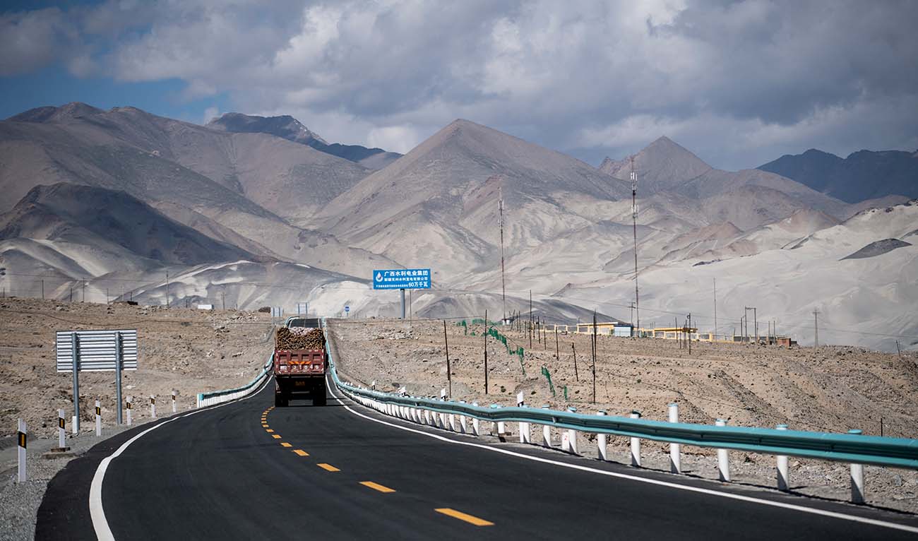 This picture taken on June 27, 2017 shows a truck driving along the China-Pakistan Friendship Highway before the Karakorum mountain range near Tashkurgan in China's western Xinjiang province. (AFP/File)
