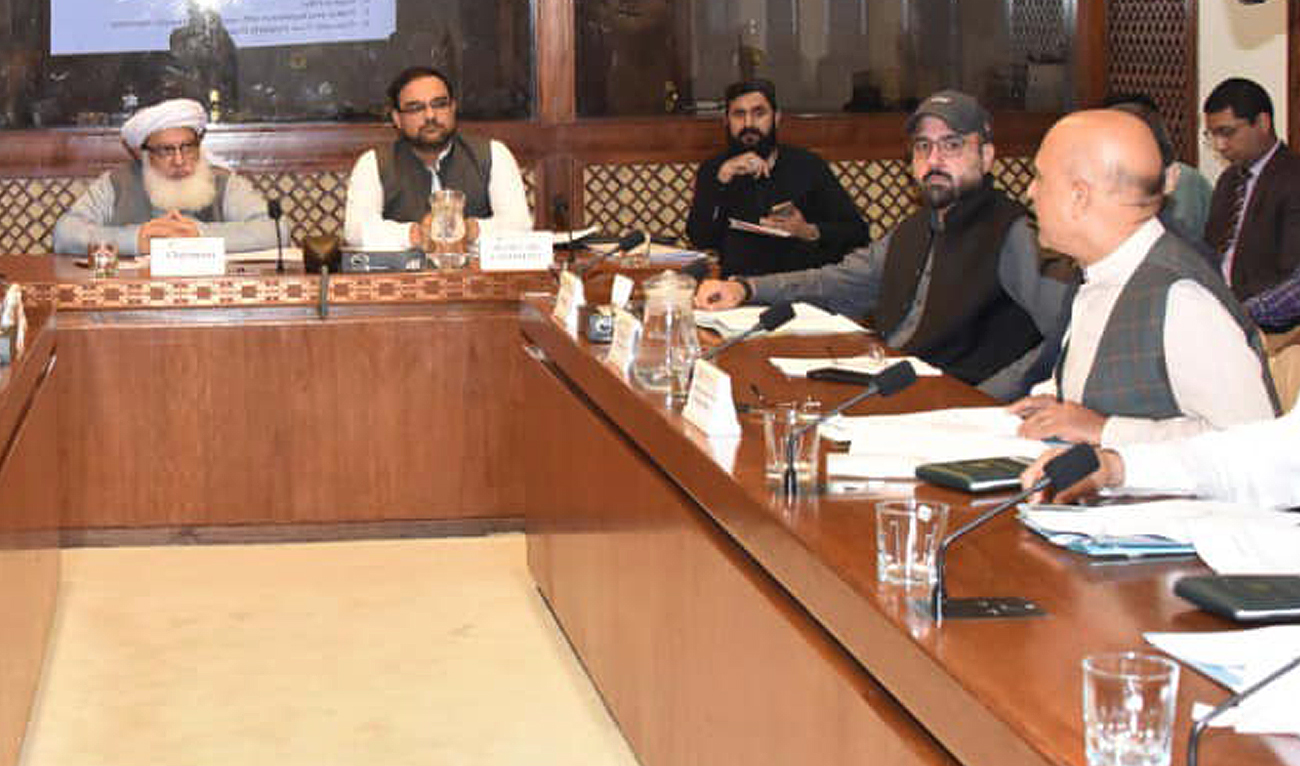 Atta-ur-Rehman (L), chairman Senate Standing Committee on Religious Affairs and Interfaith Harmony, gestures during a briefing from Federal Minister for Religious Affairs Chaudhry Salik Hussain (2R) at the Parliament House in Islamabad on July 24, 2024. (Photo courtesy: Senate of Pakistan)
