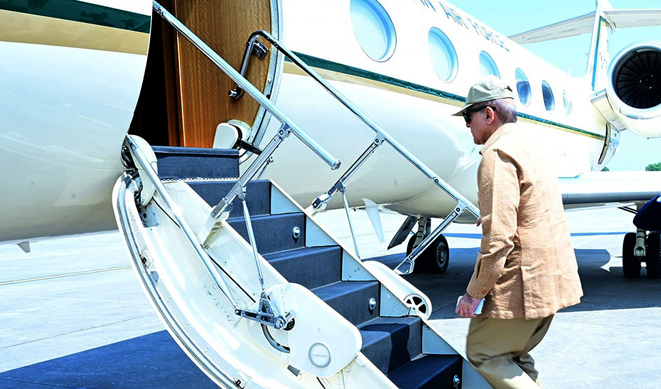 In this file photograph, taken and released by Prime Minister Office on May 23, 2024, Pakistan Prime Minister Shehbaz Sharif boarding a Pakistan Air Force aircraft at the Nur Khan Airbase in Rawalpindi. (Photo courtesy: PMO/File)