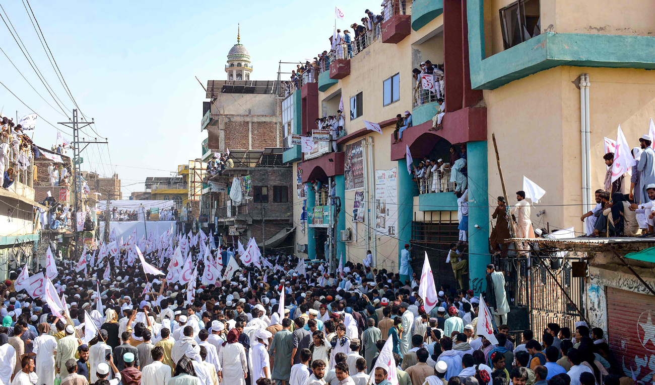 Residents take part in a peace rally to protest the recent suicide attack by militants on an army enclave in Bannu on July 26, 2024. (AFP)