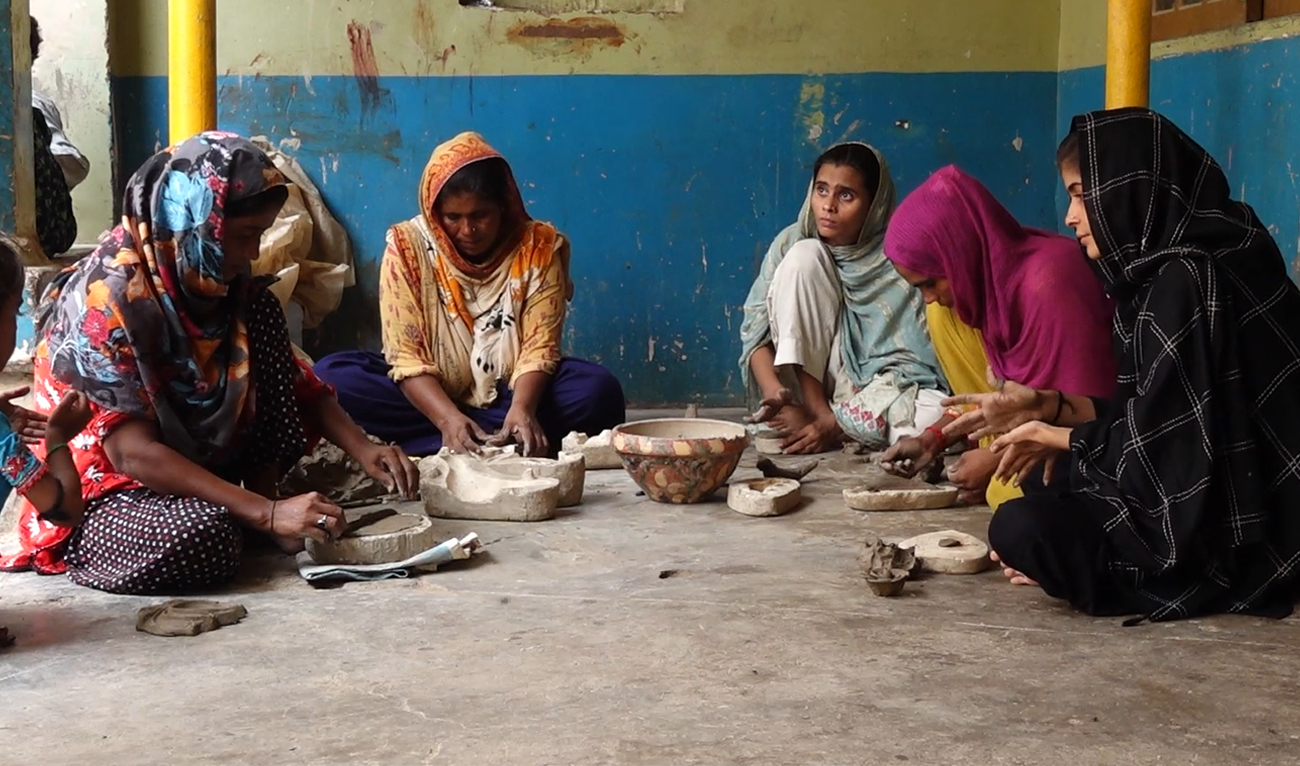 In this picture taken on July 28, 2024, Pakistani mosaic artists work on a mosaic artwork piece at their residence in Hala, Sindh province, during an interview with Arab News. (AN Photo)