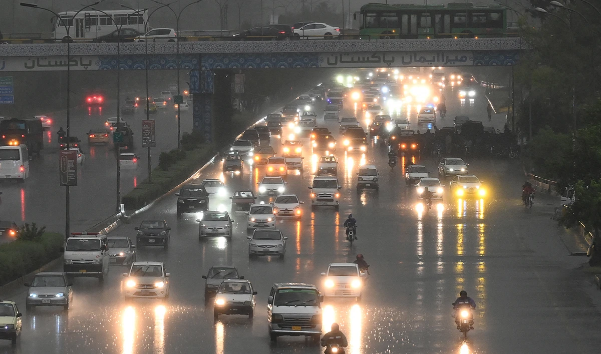 Commuters drive along a busy road during a heavy rainfall in Islamabad on May 10, 2024. (AFP/File)