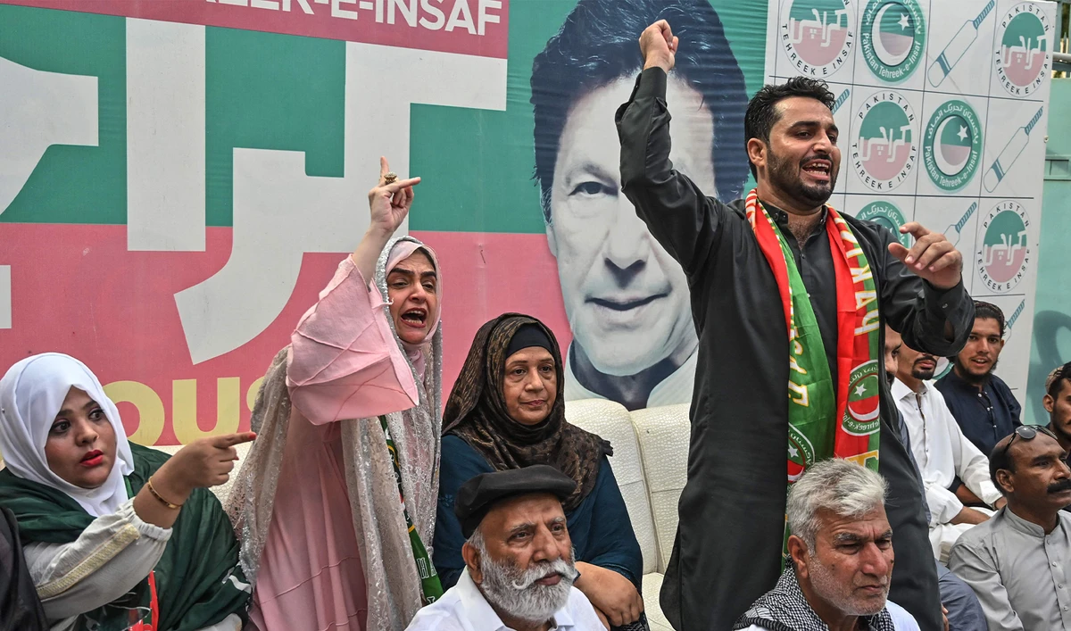 Supporters of former prime minister Imran Khan and his Pakistan Tehreek-e-Insaaf (PTI) party celebrate after a Supreme Court verdict, in Karachi on July 12, 2024. (AFP)
