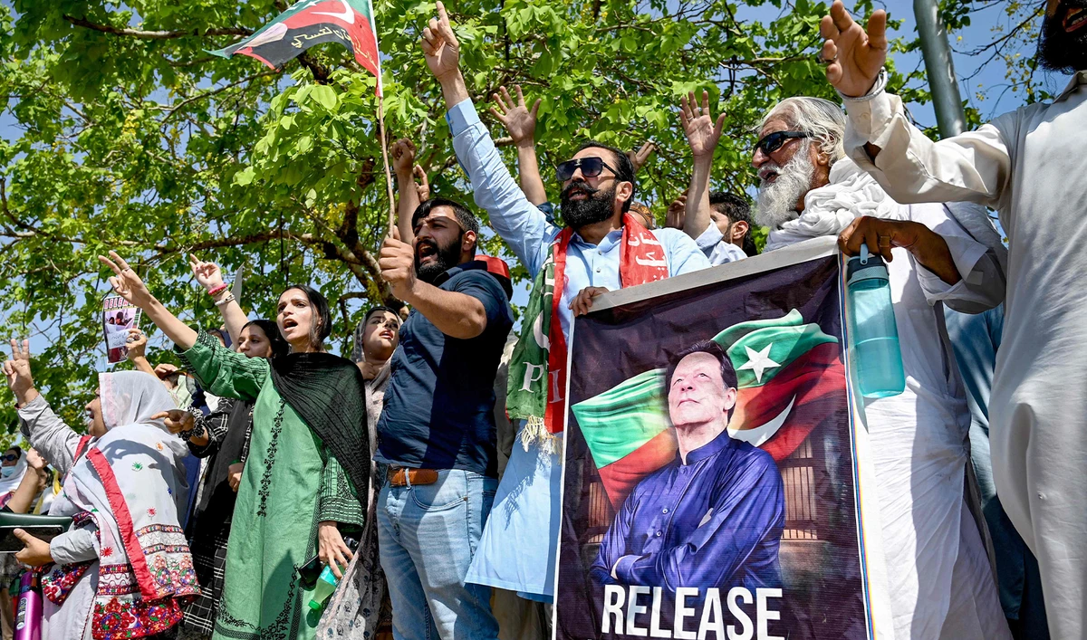 Supporters of Pakistan's former prime minister and Pakistan Tehreek-e-Insaaf (PTI) party leader Imran Khan, celebrate after a court verdict overturned his illegal marriage conviction, outside the court building in Islamabad on July 13, 2024. (AFP/File)