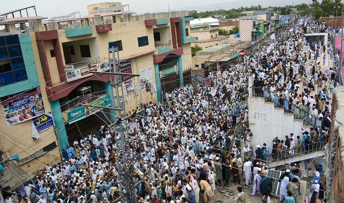 Residents take part in a peace rally to protest after the recent suicide attack by militants on an army enclave in Bannu, on July 19, 2024. (AFP)