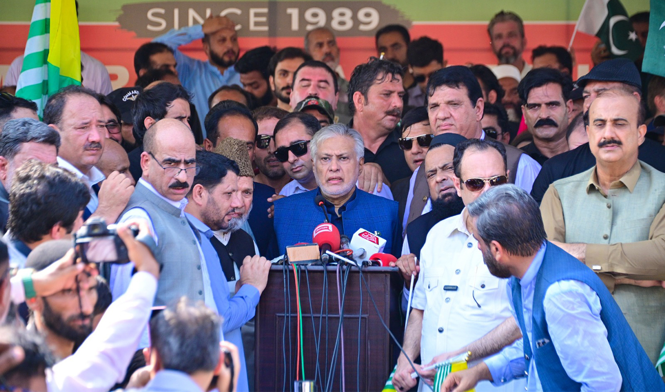 In this handout photo released by the Pakistan Foreign Ministry, Deputy Prime Minister Ishaq Dar, center, addresses a crowd of people to show solidarity with the Kashmiri people on the eve of the fifth anniversary of India's decision to revoke the disputed region's semi-autonomy, in Islamabad, Pakistan, on August 5, 2024. (Pakistan Foreign Ministry/AP)