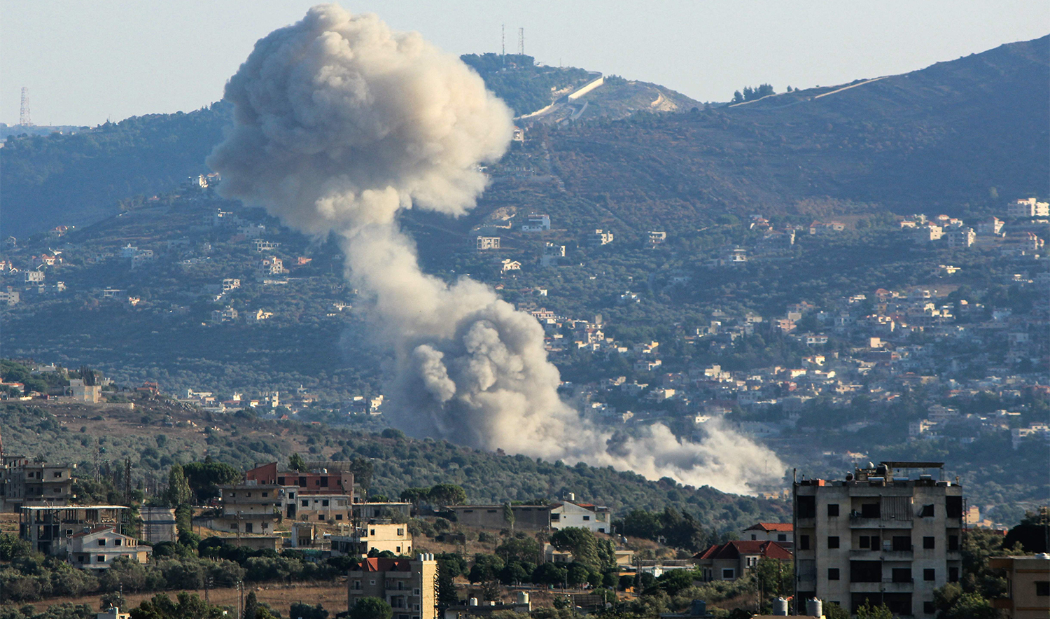 Smoke billows from the site of an Israeli strike on the southern Lebanese village of Kfar Kila on August 6, 2024. (AFP)