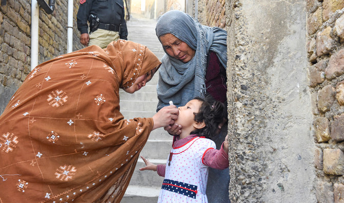 A health worker administers polio vaccine drops to a child during a vaccination campaign in Quetta on October 24, 2022. (AFP/File)
