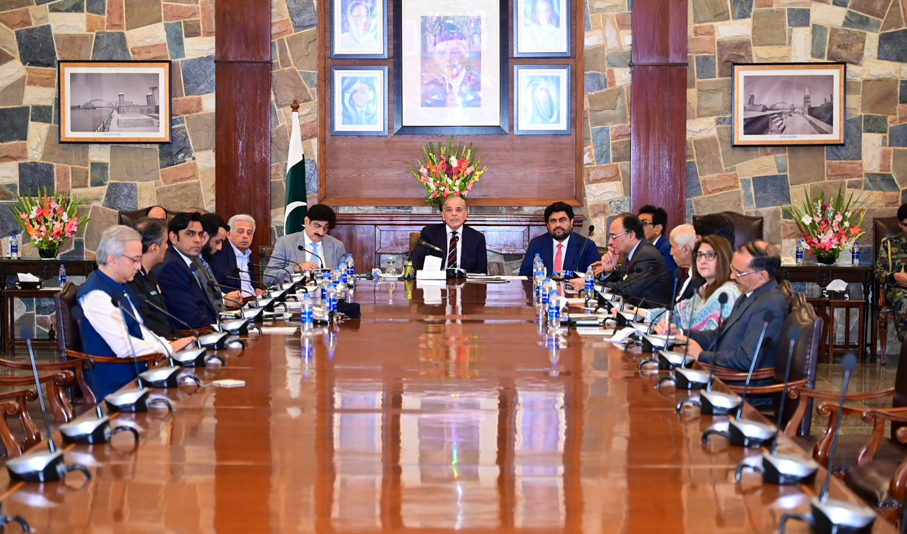 In this handout photograph, taken and released by the Prime Minister’s Office, Pakistan Prime Minister Shehbaz Sharif chairs a review meeting regarding Polio Eradication Program in Karachi on August 9, 2024. (Photo courtesy: PMO)