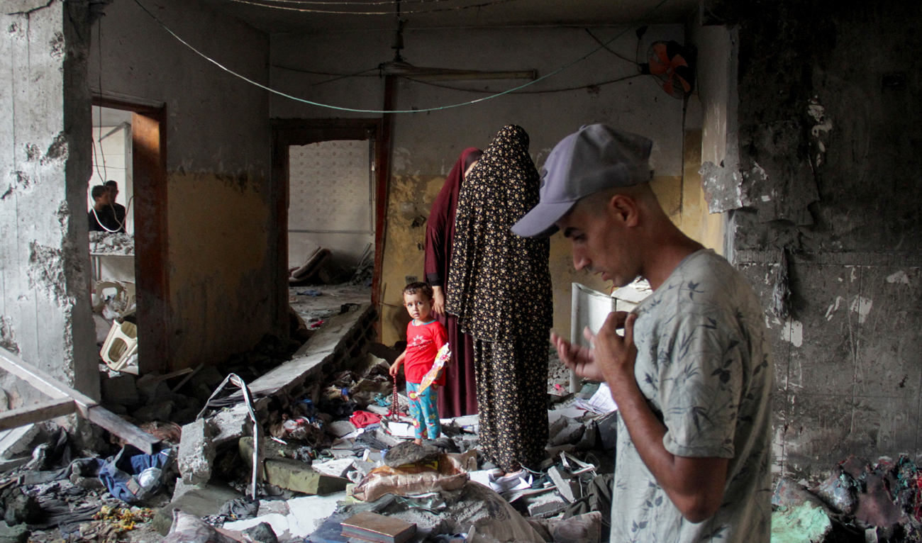 Palestinians look at the damage at the site of an Israeli strike on a school sheltering displaced people, amid the Israel-Hamas conflict, in Gaza City August 10, 2024. (REUTERS)