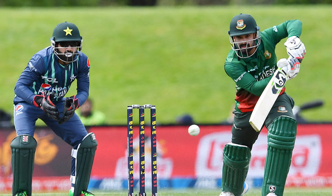Bangladesh's Litton Das (R) plays a shot in front of Pakistan's wicketkeeper Mohammad Rizwan during the Twenty20 tri-series cricket match between Pakistan and Bangladesh at Hagley Oval in Christchurch on October 13, 2022. (AFP/File)