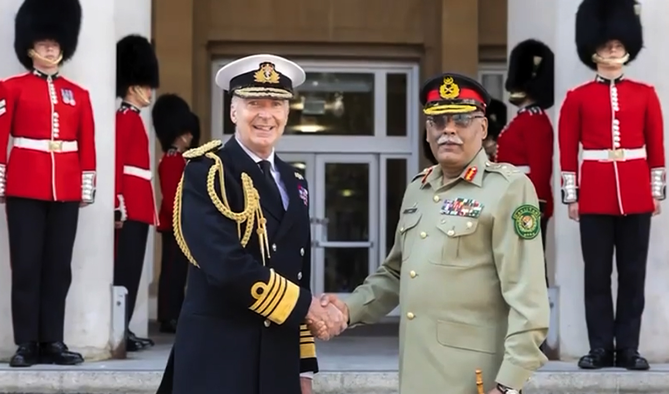 In this screengrab, taken from a handout video released by Pakistan’s Inter-Service Public Relations (ISPR), Pakistan Army’s Chairman Joint Chiefs of Staff Committee General Sahir Shamshad Mirza shakes hands with Britain’s Chief of Defense Staff, Admiral Sir Tony Radakin, in London on August 10, 2024. (ISPR)