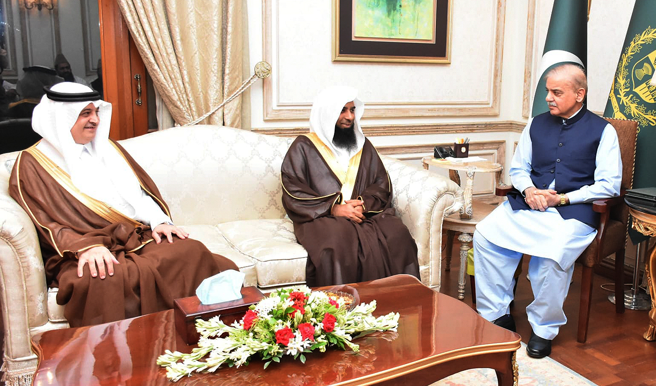 In this handout photograph, taken and released by Pakistan’s Press Information Department, Prime Minister Shehbaz Sharif (right) gestures during a meeting with Imam of the Prophet’s Mosque, Sheikh Dr. Salah bin Muhammad Al-Budair, in Lahore on August 11, 2024. (PID)