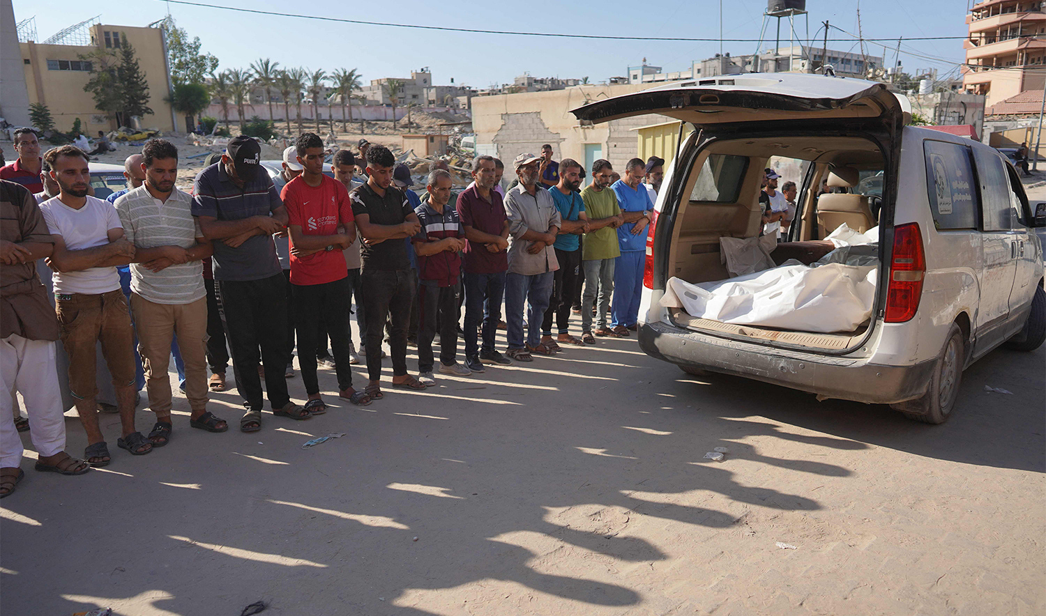 Palestinians attend the funeral of members of the Najjar family, killed in an Israeli strike, in Khan Yunis in the southern Gaza Strip on August 12, 2024, amid the ongoing conflict between Israel and the Hamas militant group. (AFP)