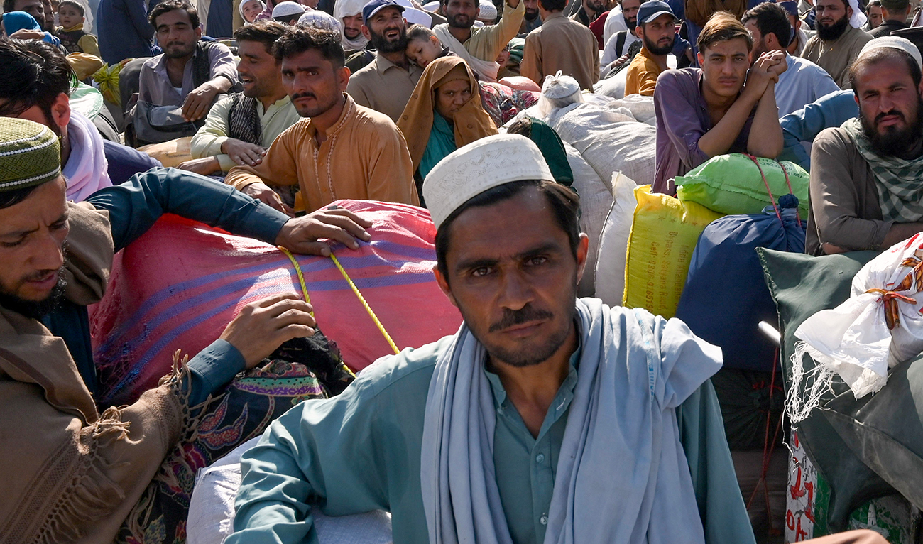 Afghan refugees wait in a queue to cross the Pakistan-Afghanistan border in Torkham on October 27, 2023. (AFP/File)