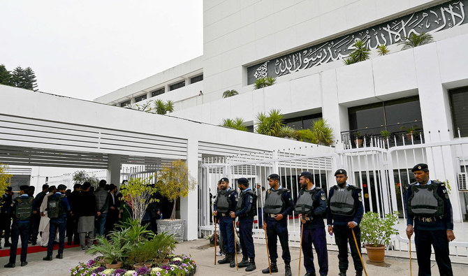 In this file photograph, taken on February 29, 2024, security personnel stand guard outside the parliament house building in Islamabad. (AFP)