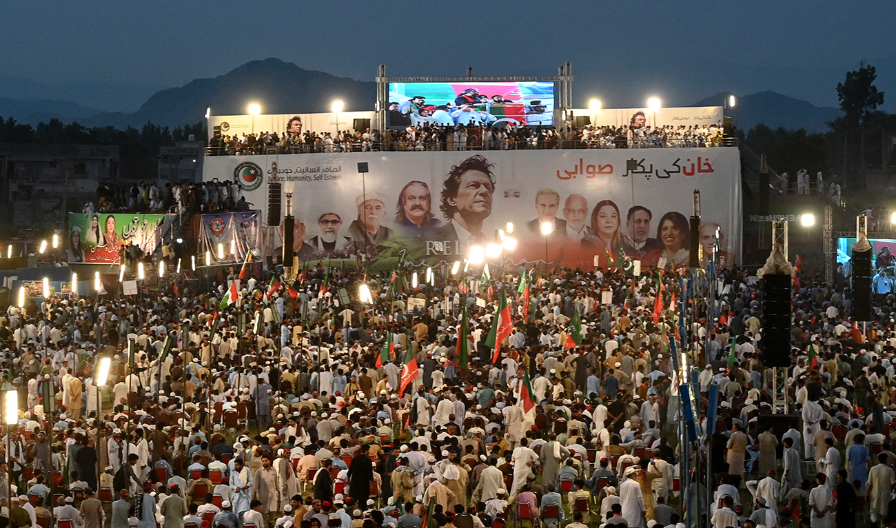 Supporters of jailed former prime minister Imran Khan and Pakistan Tehreek-e-Insaf (PTI) party gather during a rally to mark one-year anniversary of Khan's imprisonment, in Swabi on August 5, 2024. (AFP/File)