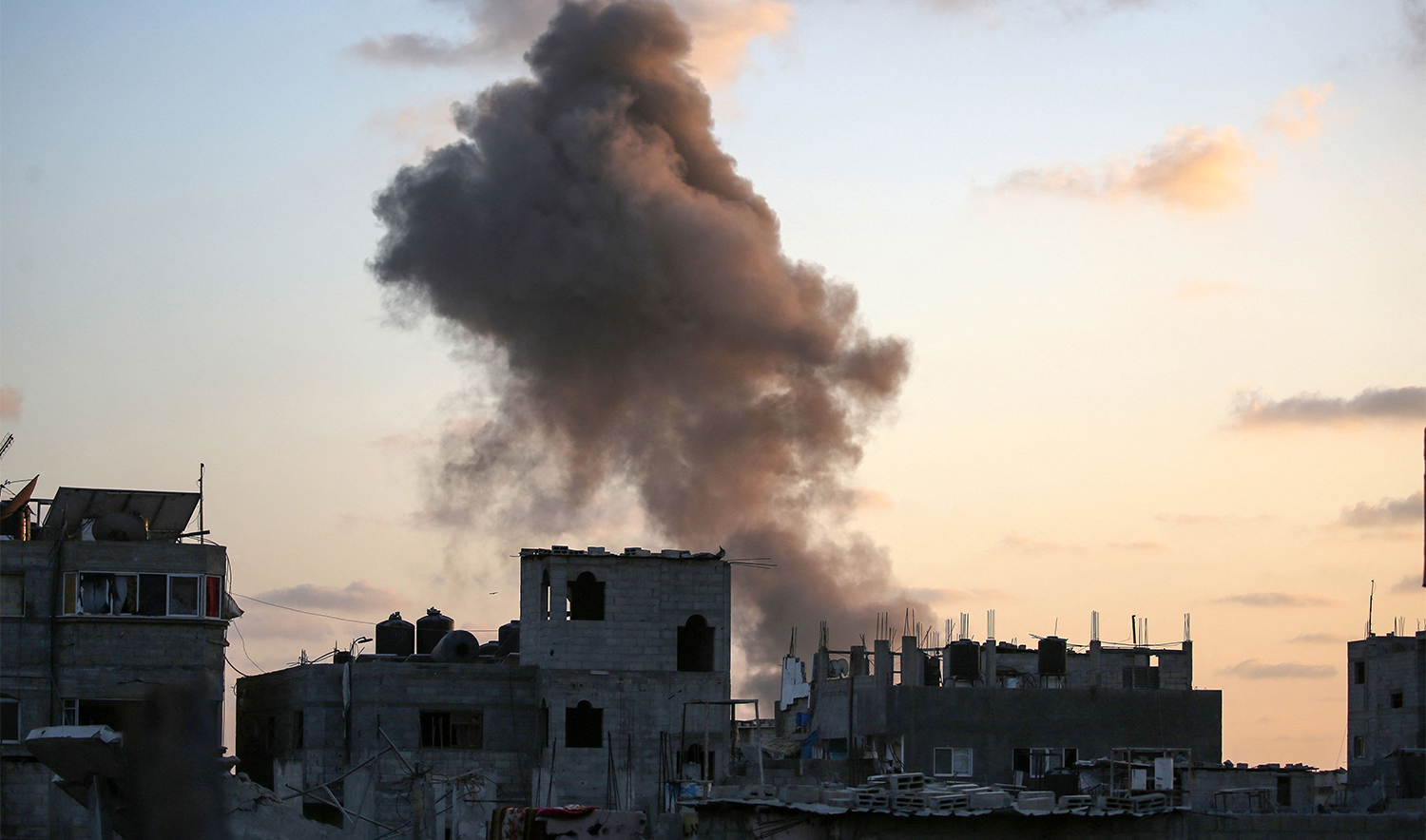 Smoke rises as Israeli troops target a building in the Nuseirat refugee camp in the central Gaza Strip on August 22, 2024. (AFP)