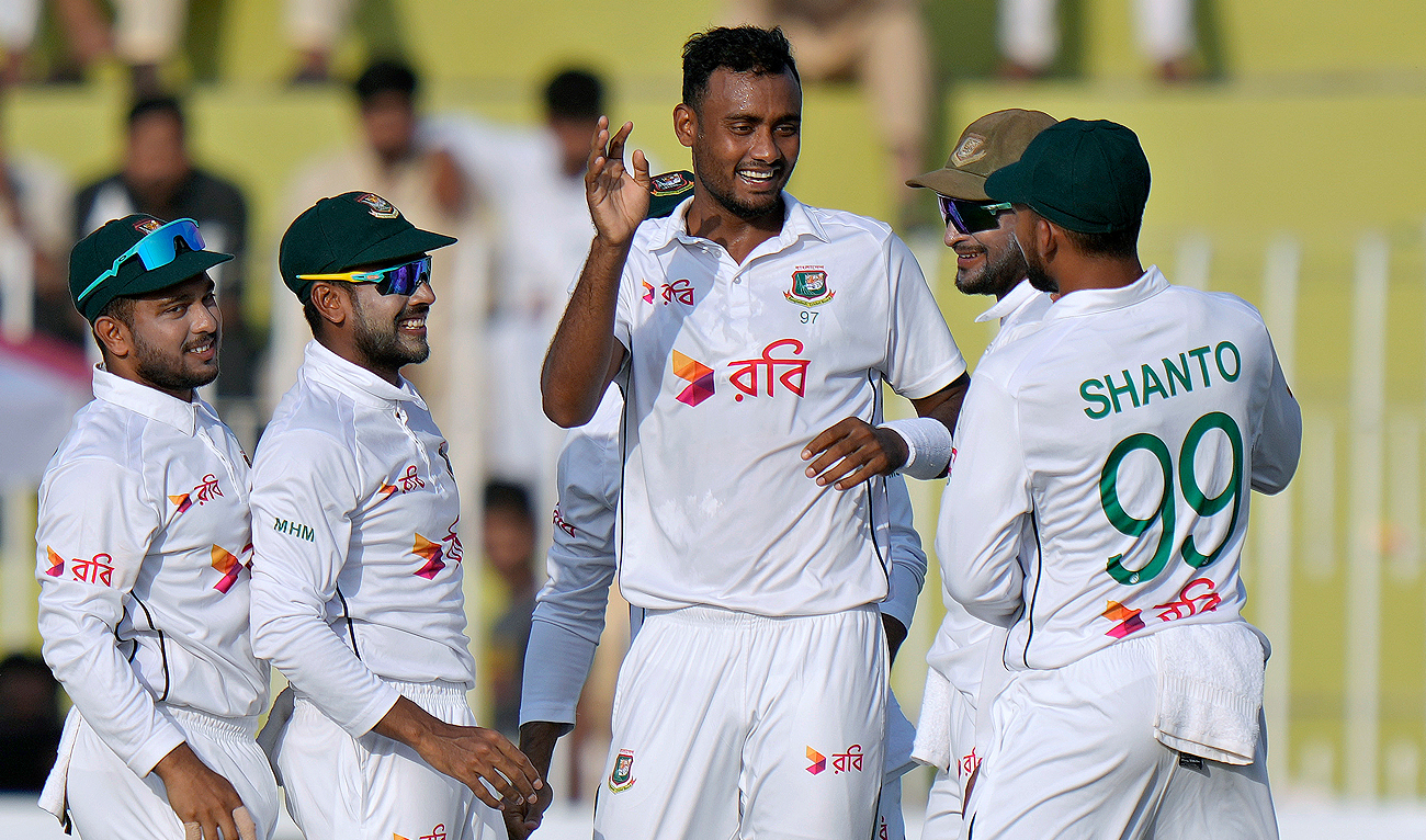 Bangladesh’s Shoriful Islam, center, celebrates with teammates after taking the wicket of Pakistan’s Saim Ayub during the fourth day of first cricket test match between Pakistan and Bangladesh, in Rawalpindi on August 24, 2024. (AP)
