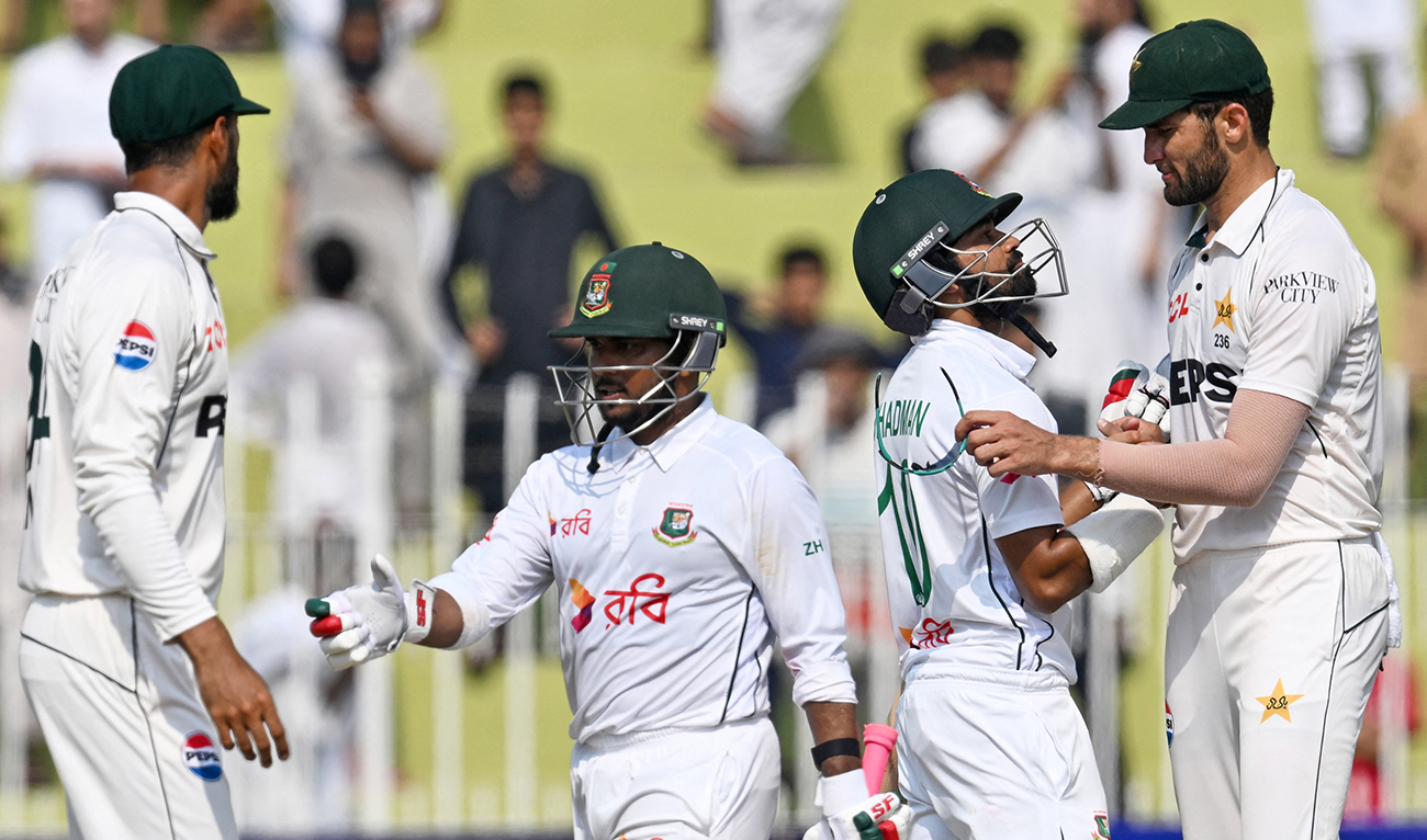 Bangladesh's Shadman Islam (2R) and Zakir Hasan (2L) greet Pakistan's players after their team's win at the end of the fifth and final day of the first Test cricket match between Pakistan and Bangladesh at the Rawalpindi Cricket Stadium in Rawalpindi on August 25, 2024. (AFP)