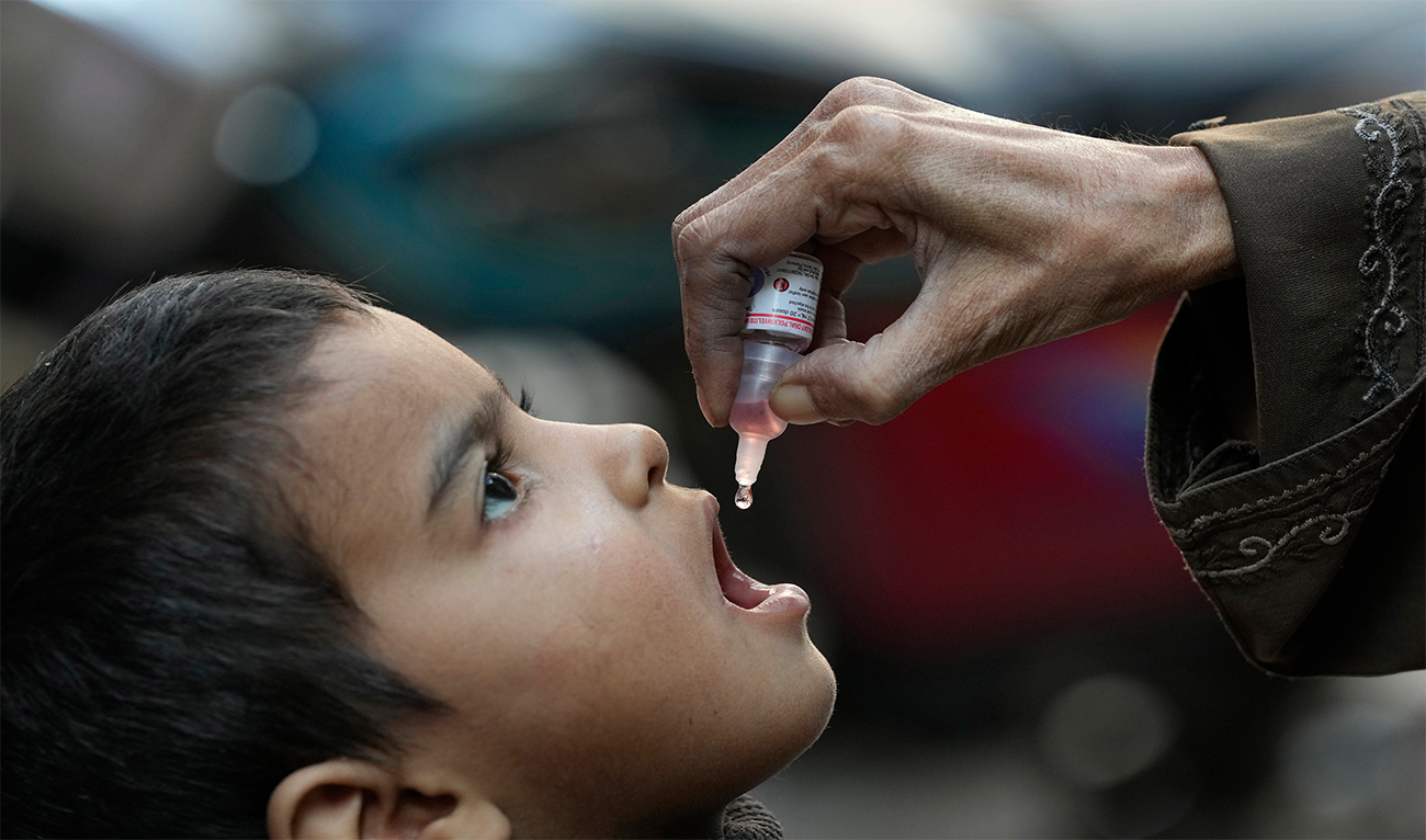 A health worker administers a polio vaccine to a child in Karachi, Pakistan, on January 8, 2024. (AP/File)