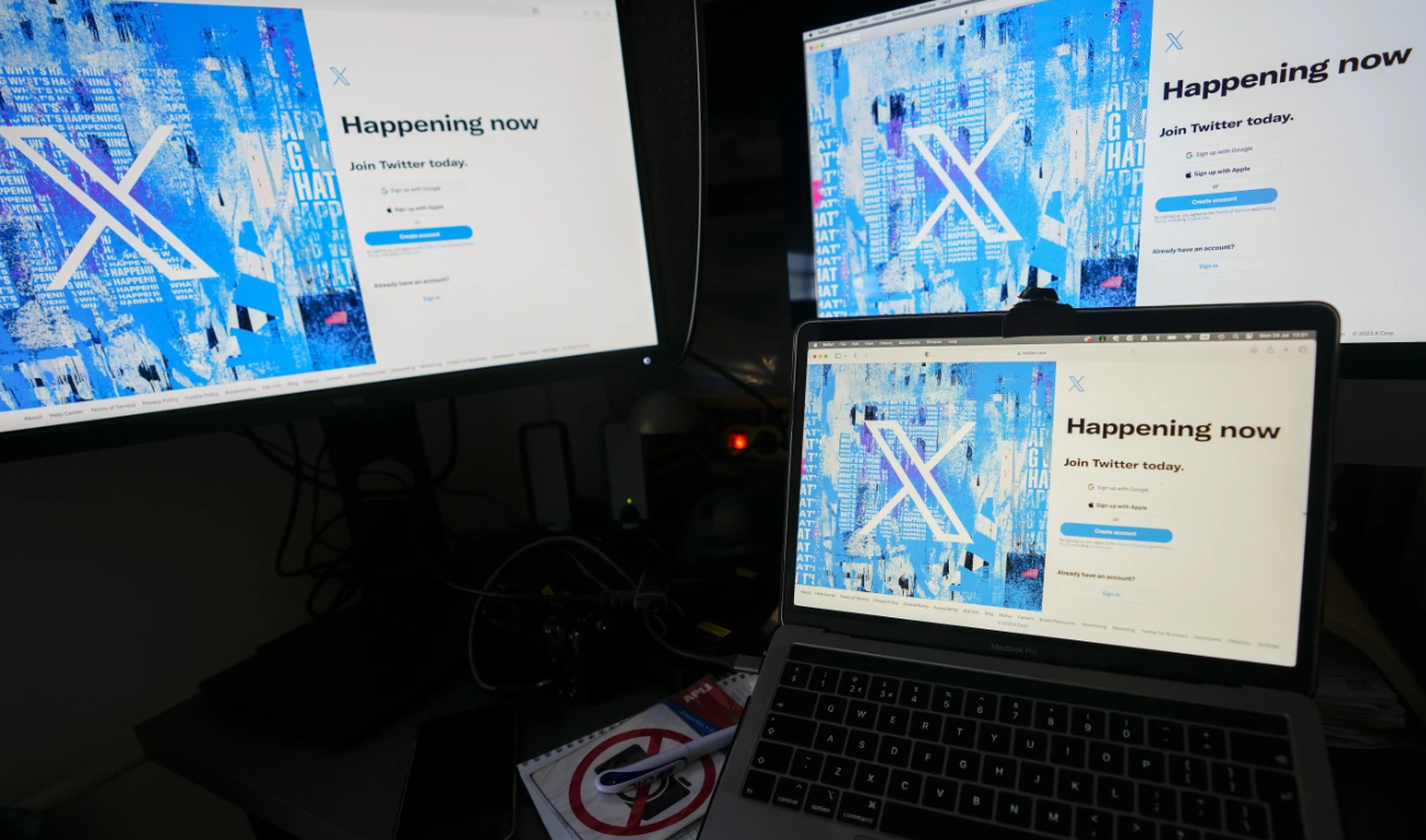 In this file photo, taken on July 24, 2023, computer monitors and a laptop display the X, formerly known as Twitter, sign-in page in Belgrade, Serbia. (AP/File)