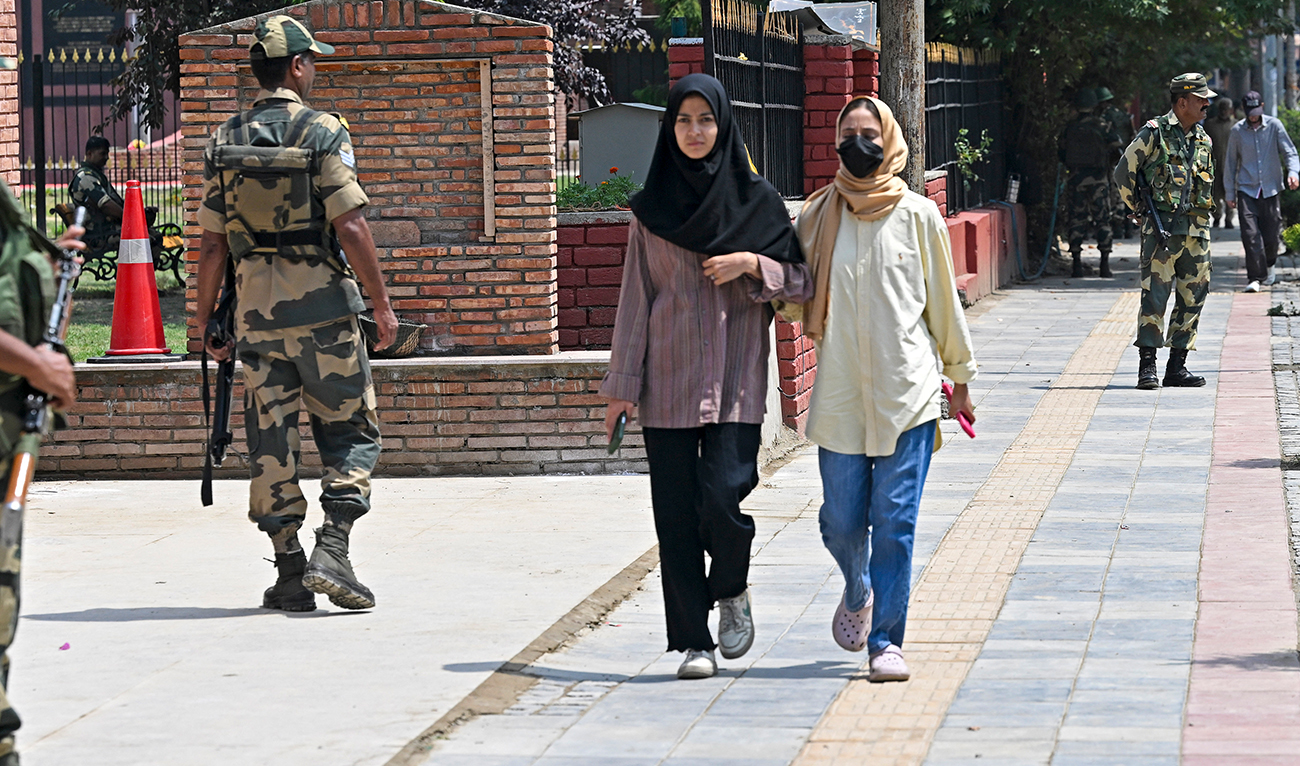Indian Border Security Force (BSF) soldiers stand guard along a street in Srinagar on August 16, 2024. (AFP/File)