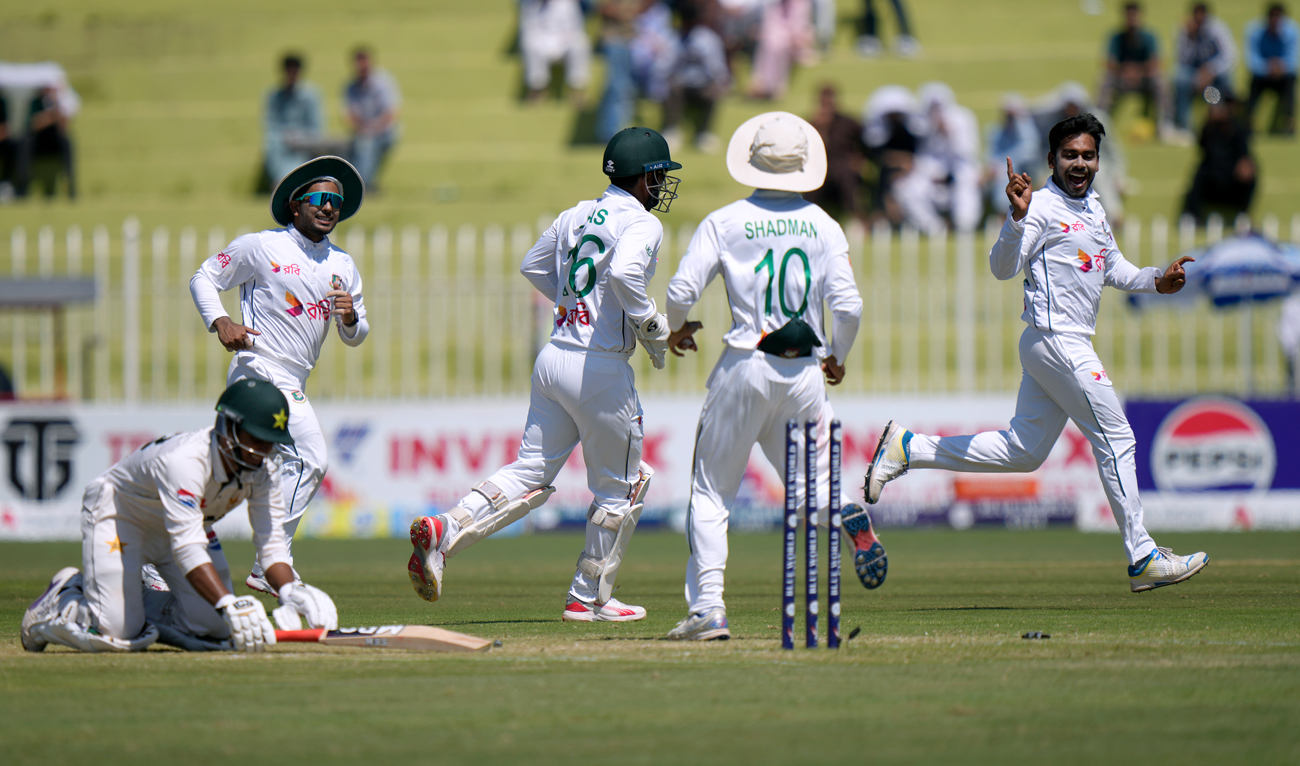 Bangladesh’s Mehidy Hasan Mirza, right, and teammates celebrate after dismissal of Pakistan’s Saim Ayub, left, during the second day of second test cricket match between Pakistan and Bangladesh, in Rawalpindi on August 31, 2024. (AP)