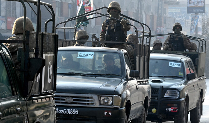 A Pakistan Army convoy patrols along a road in Peshawar on February 7, 2024. (AFP/File)