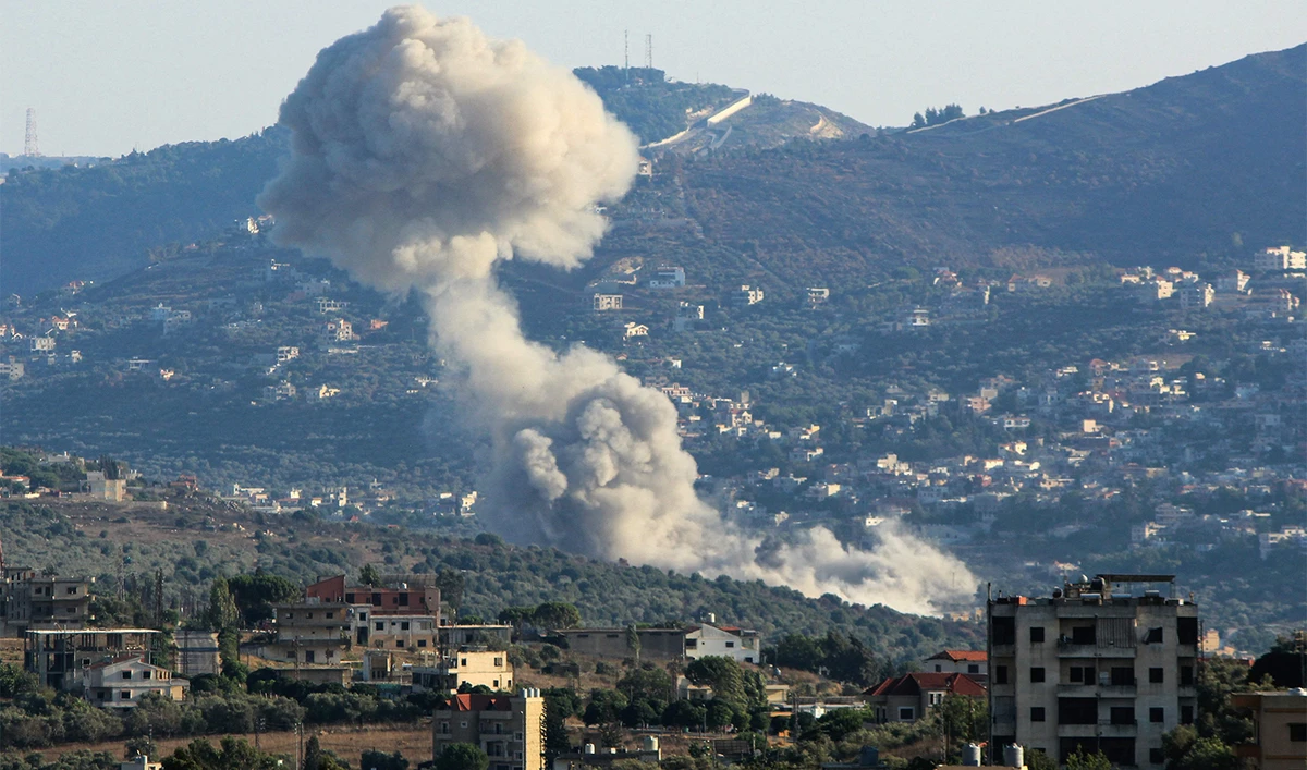 Smoke billows from the site of an Israeli strike on the southern Lebanese village of Kfar Kila on August 6, 2024. (AFP)