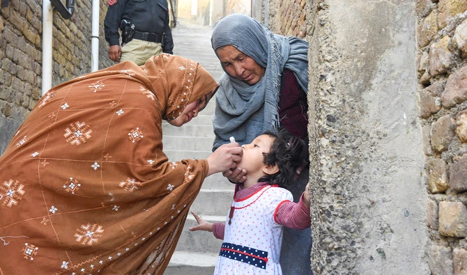 A health worker administers polio vaccine drops to a child during a vaccination campaign in Quetta on October 24, 2022. (AFP/File)