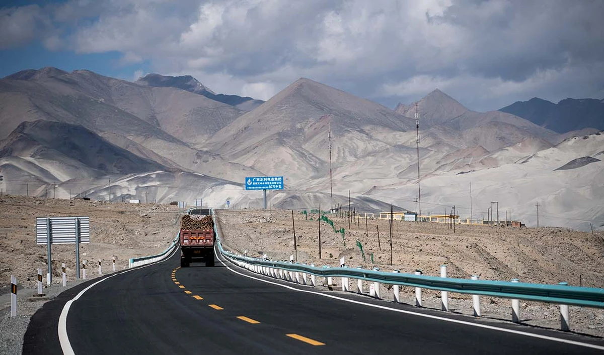 This picture taken on June 27, 2017 shows a truck driving along the China-Pakistan Friendship Highway before the Karakorum mountain range near Tashkurgan in China's western Xinjiang province. (AFP/File)