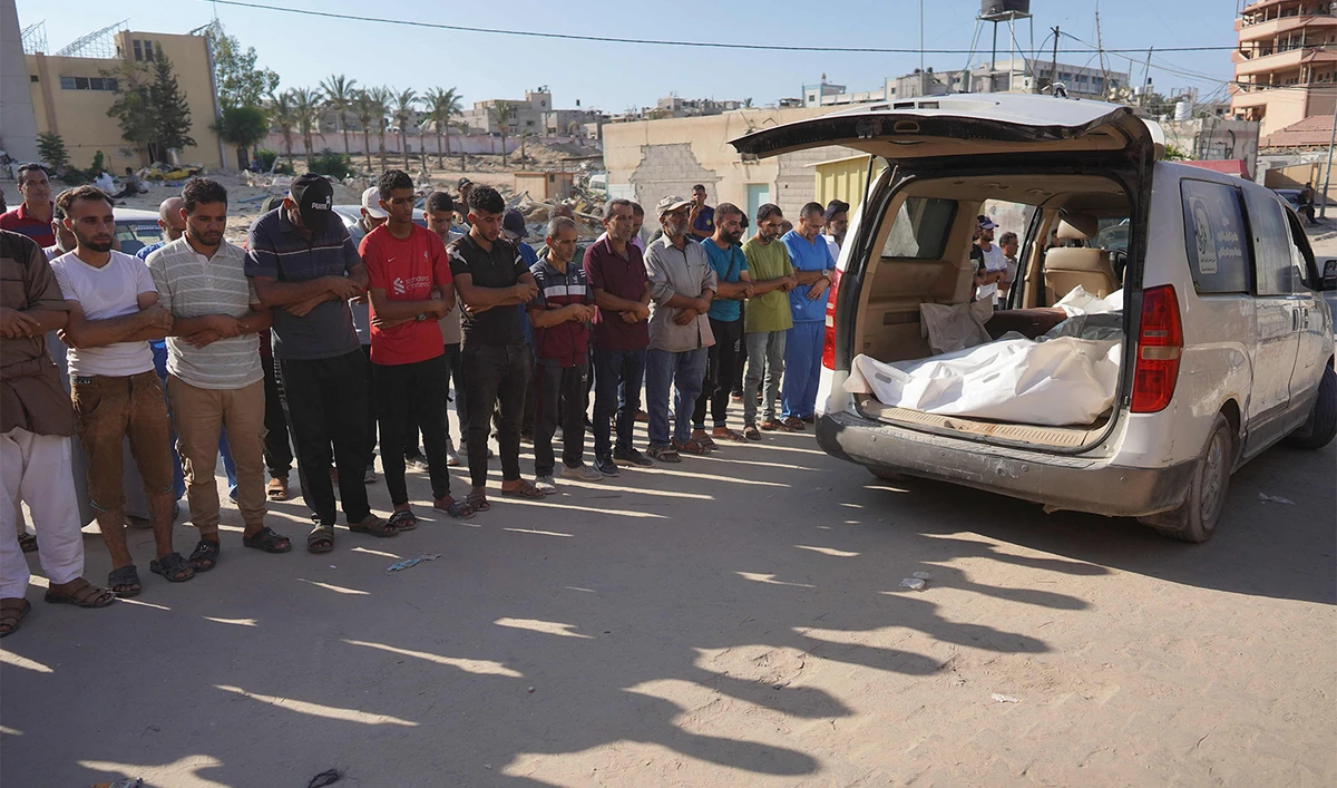 Palestinians attend the funeral of members of the Najjar family, killed in an Israeli strike, in Khan Yunis in the southern Gaza Strip on August 12, 2024, amid the ongoing conflict between Israel and the Hamas militant group. (AFP)