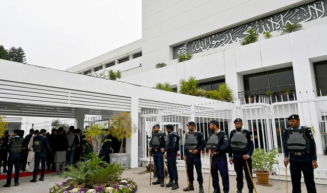 In this file photograph, taken on February 29, 2024, security personnel stand guard outside the parliament house building in Islamabad. (AFP)