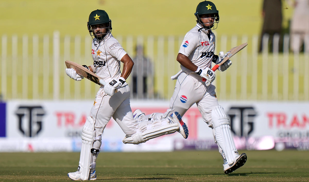 Pakistan's Saud Shakeel, left, and Saim Ayub run between the wicket during the first day of first cricket test match between Pakistan and Bangladesh, in Rawalpindi, Pakistan, Wednesday, Aug. 21, 2024. (AFP/File)