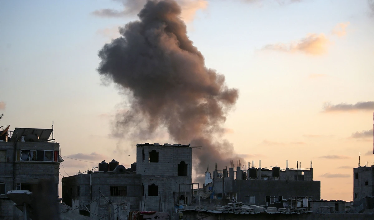 Smoke rises as Israeli troops target a building in the Nuseirat refugee camp in the central Gaza Strip on August 22, 2024. (AFP)