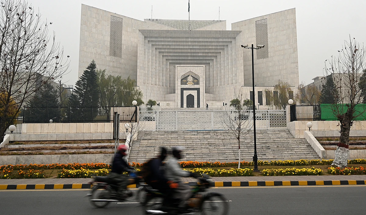 Commuters ride past the Pakistan's Supreme Court building in Islamabad on January 12, 2024. (AFP/File)