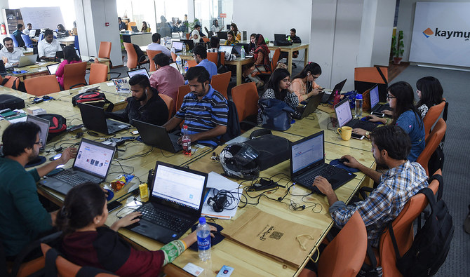 This file photograph, taken on November 19, 2015, shows Pakistani employees of an online marketplace company at work in Karachi. (AFP/File)
