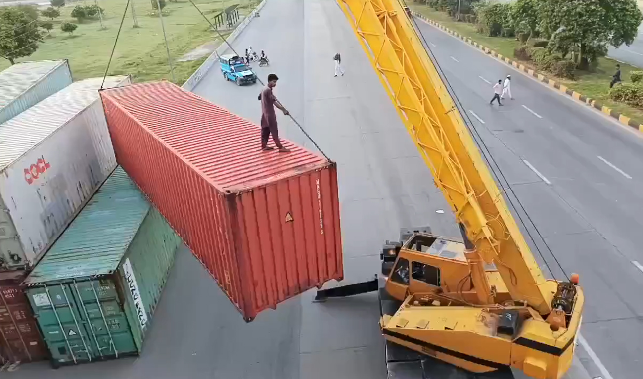 In this screengrab, taken from a video posted on social media platform X by Pakistan Tehreek-e-Insaf party leader Musarat Cheema, authorities block a key road in Islamabad on September 8, 2024, ahead of jailed former Prime Minister Imran Khan’s party rally to press for his release. (Photo courtesy: Musarat Cheema)