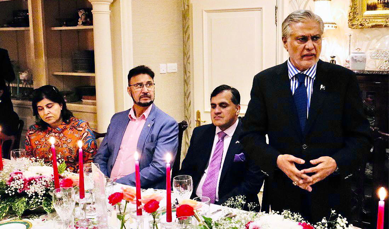 Deputy Prime Minister Ishaq Dar (right) speaks to a group of British-Pakistani members of parliament during a dinner at the Pakistan House in London on September 8, 2024. (@PakistaninUK/X)