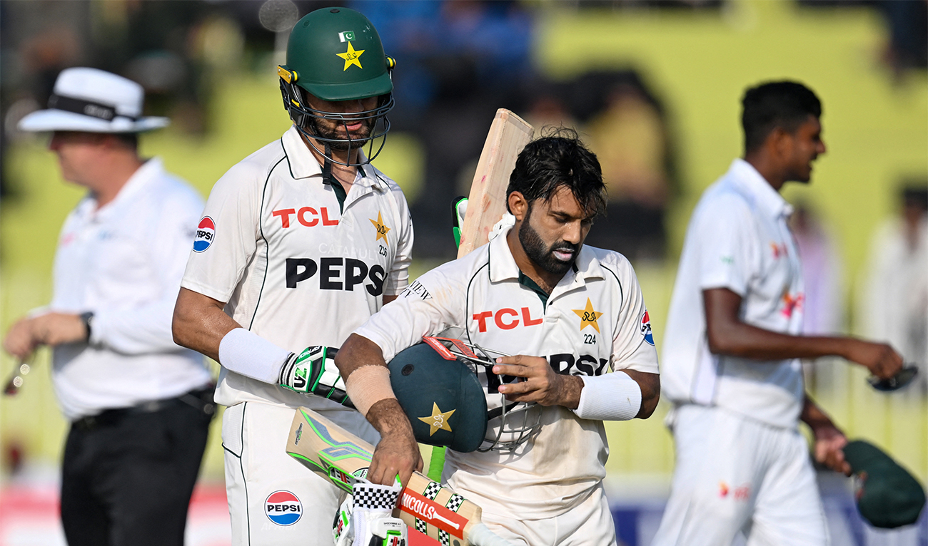 Pakistan's Shaheen Shah Afridi (2L) and Mohammad Rizwan (2R) walk back to the pavilion at the end of first innings on the second day of first Test cricket match between Pakistan and Bangladesh at the Rawalpindi Cricket Stadium in Rawalpindi on August 22, 2024. (AFP/File)
