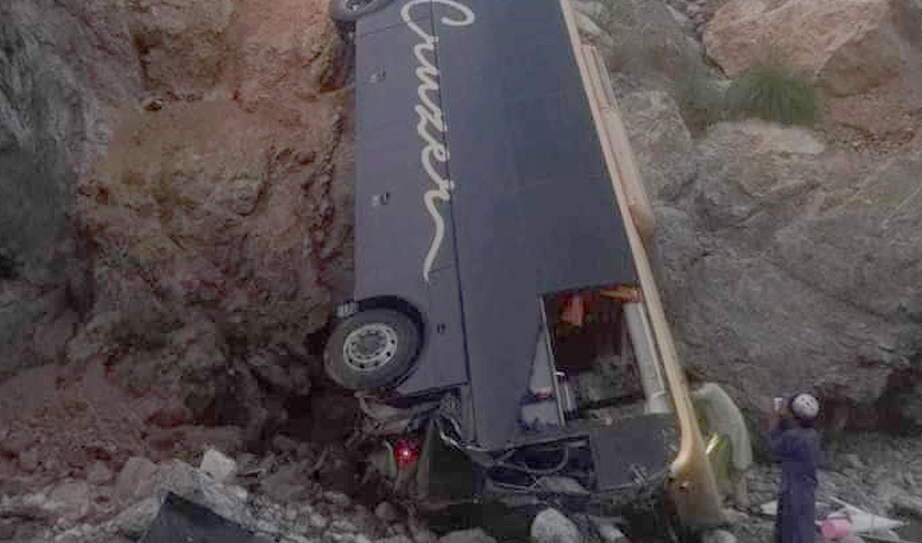 Bystanders stand next to the wreckage of a bus after an accident in in Dana Sar, some 80 kilometers away from Zhob city, Balochistan on September 14, 2024. (Photo courtesy: Levis Force Sherani district)