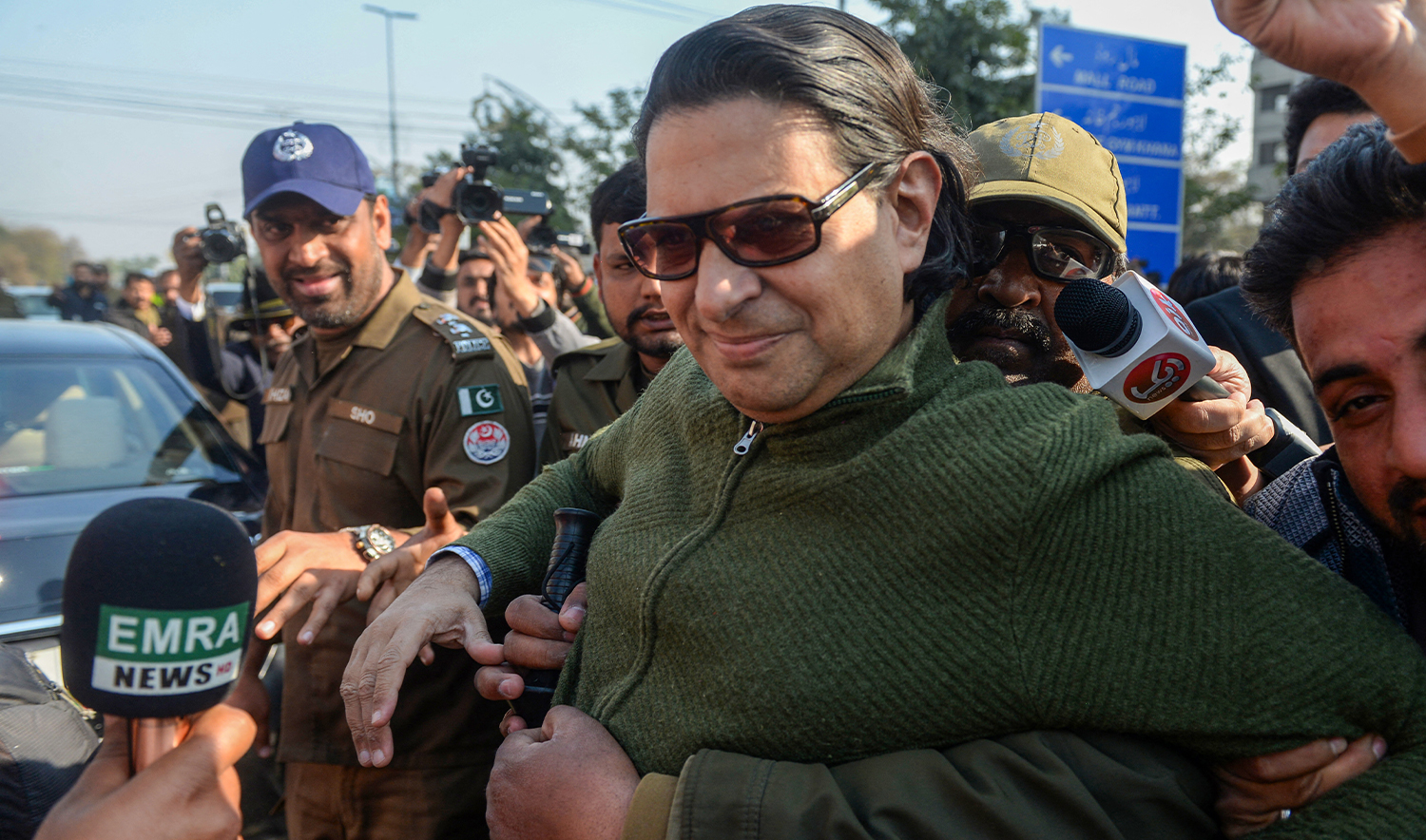 Policemen detain Salman Akram Raja (C), a member of former prime minister Imran Khan's Pakistan Tehreek-e-Insaf (PTI) party at a protest against the alleged skewing in the national election results, in Lahore on February 17, 2024. (AFP/File)