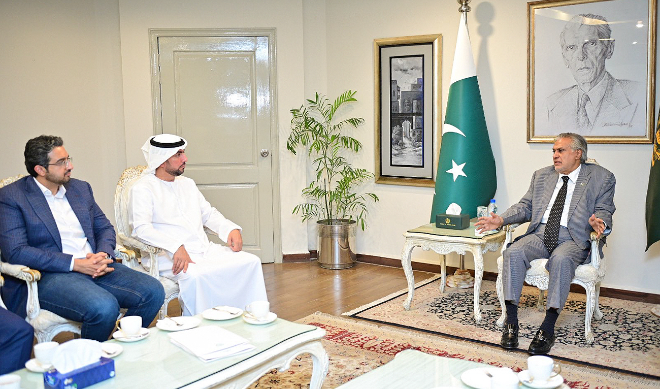 Pakistan’s Deputy Prime Minister and Foreign Minister Ishaq Dar (R) speaks during a meeting with Abu Dhabi Ports CEO Amir Maghami (2L) in Islamabad on September 19, 2024. (Photo courtesy: X/ @DPM_PK)
