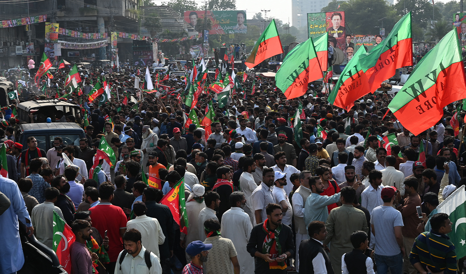 Activists and supporters of opposition party Pakistan Tehreek-e-Insaf (PTI) gather in Lahore on October 28, 2022. (AFP/File)