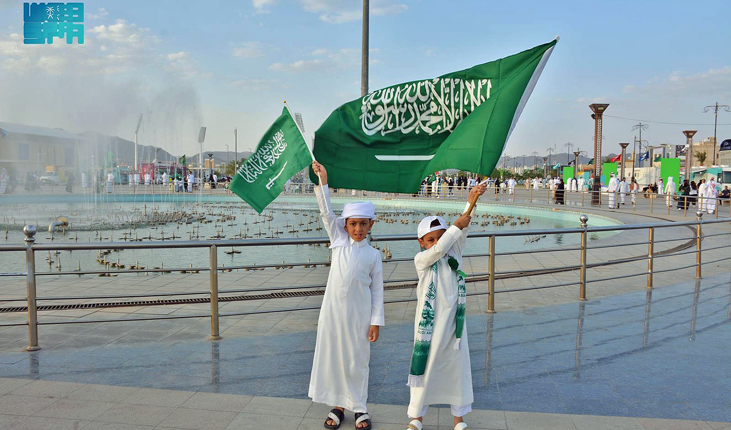 The picture shared by the Saudi Press Agency on September 23, 2024, shows boys holding the Saudi national flag. (Saudi Press Agency)