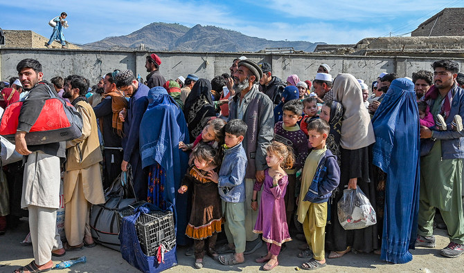 Afghan refugees wait in a queue to cross the Pakistan-Afghanistan border in Torkham on October 27, 2023. (AFP/File)