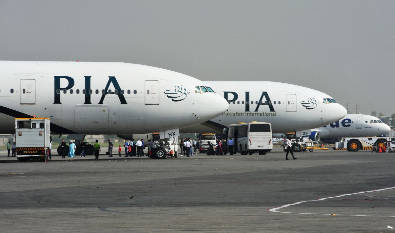 Pakistan International Airline (PIA) planes are positioned on the tarmac at the Benazir Bhutto International Airport in Islamabad on October 10, 2012. (AFP/File)