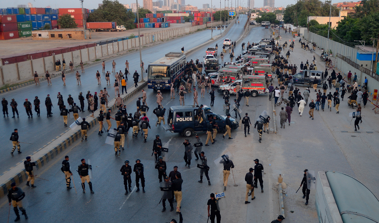 Police officers and paramilitary soldiers stand guard at the area leading toward the US Consulate, to stop the Pakistani Shiite Muslims who protest the killing of Lebanon’s Hezbollah leader Sayyed Hassan Nasrallah in an Israeli air strike in Beirut, in Karachi, Pakistan September 29, 2024. (REUTERS)